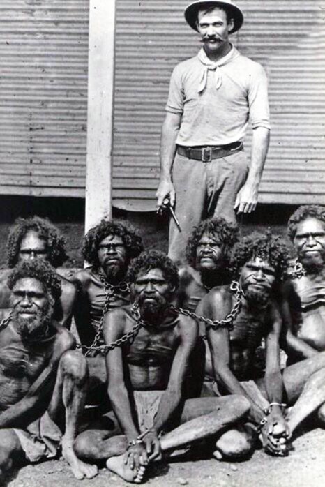 Australian Aborigines in chains at Wyndham prison, 1902.jpg